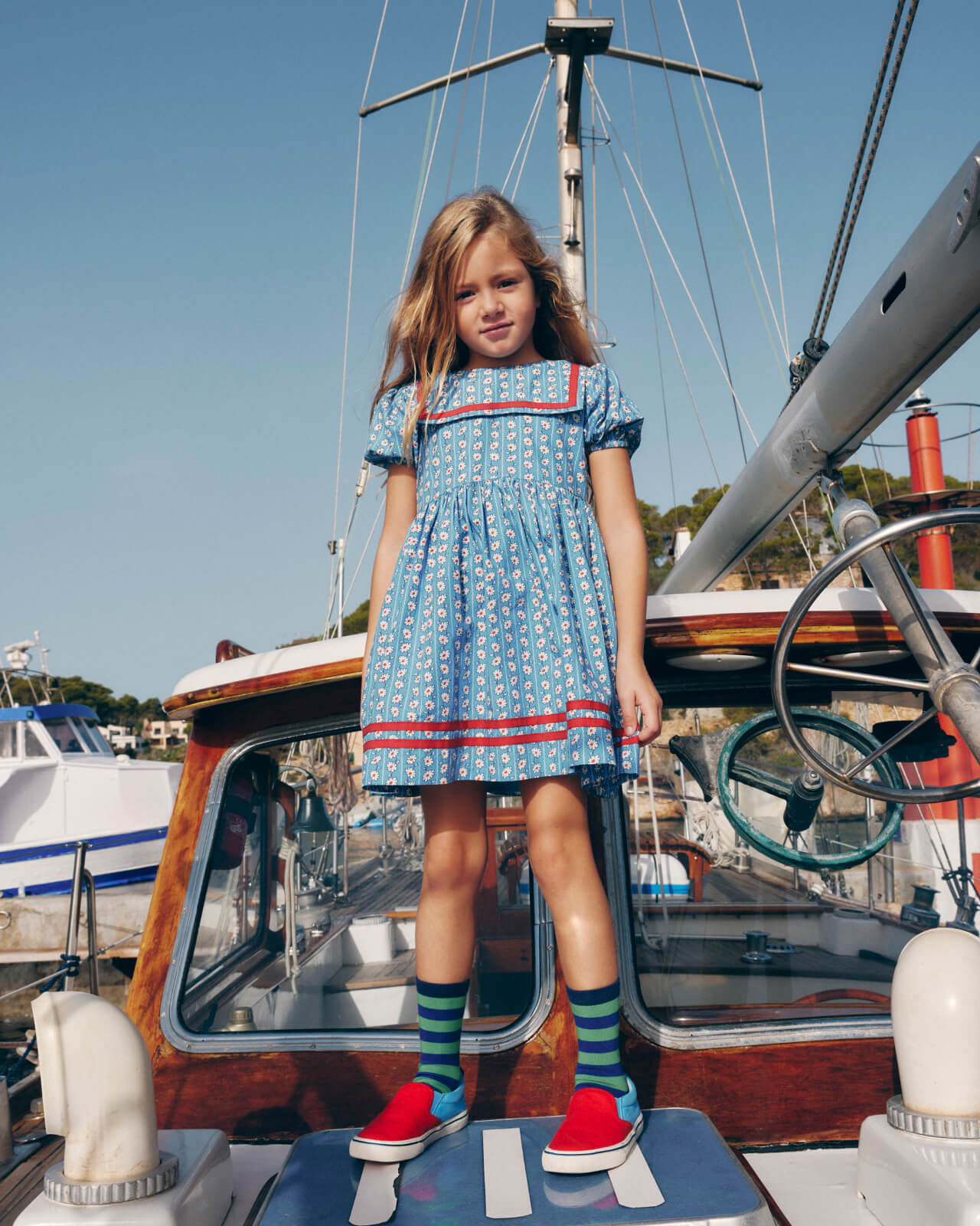 "Shop the Dress" linking to girls' Heritage Sailor Dress - Arctic Blue Daisy Stripe