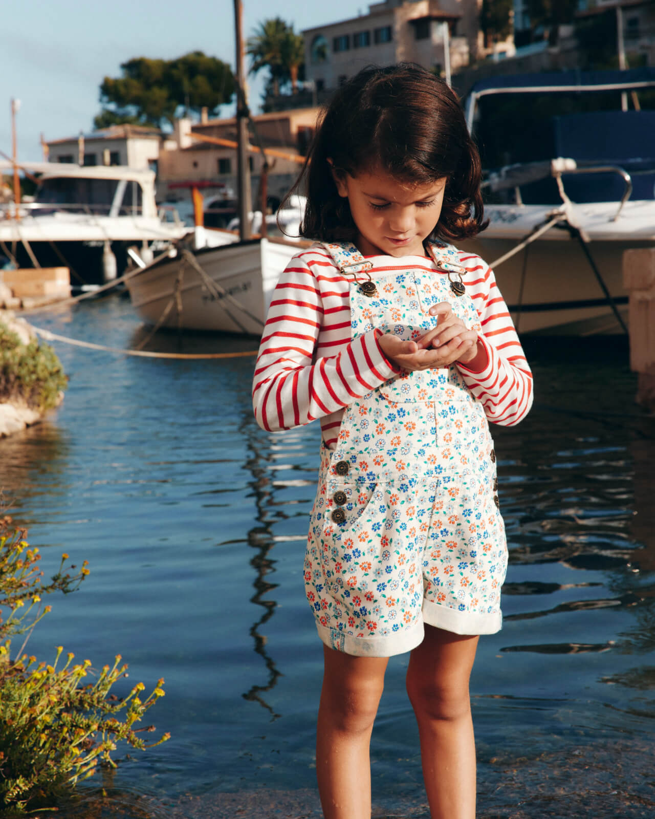 "Shop the Dungarees" linking to girls' Heart Pocket Short Dungarees - Vanilla White Vintage Daisy