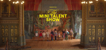 Stage with performers and 'The Mini Talent Show' text in a decorative theatre setting