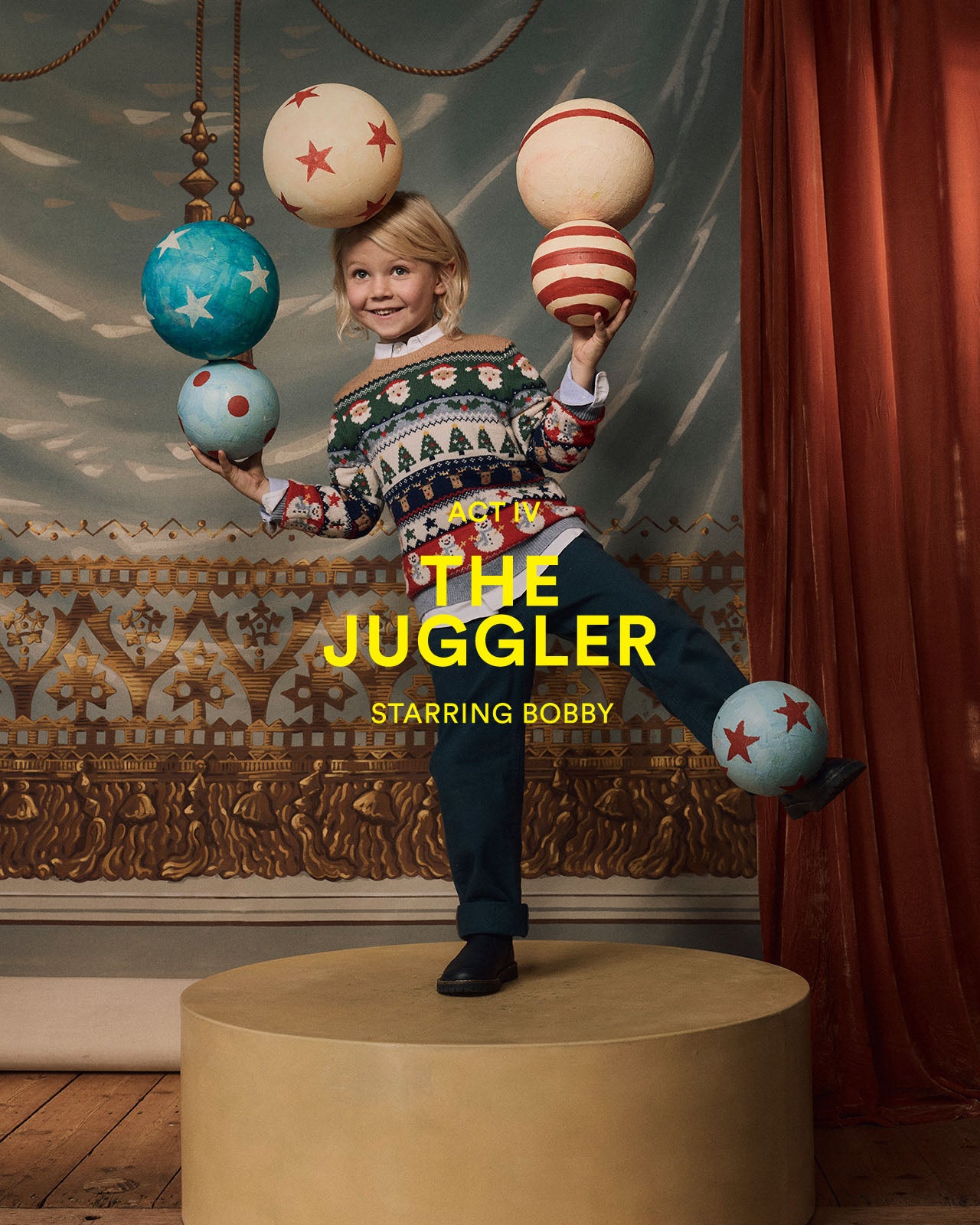 Child juggling colorful balls with text 'The Juggler' and 'Starring Bobby' in a decorative setting. 