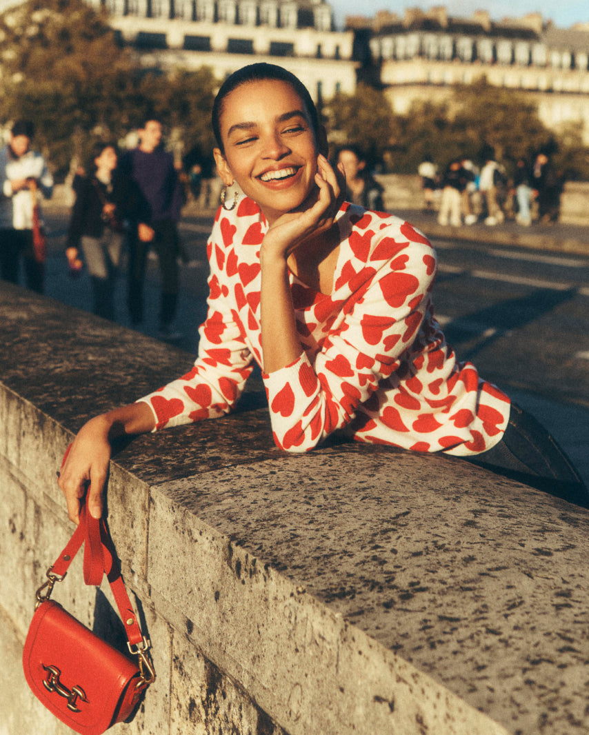 Boden female model wearing heart pattern boden top