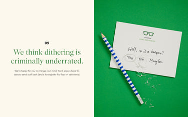 Note card with text and a pencil on a green background